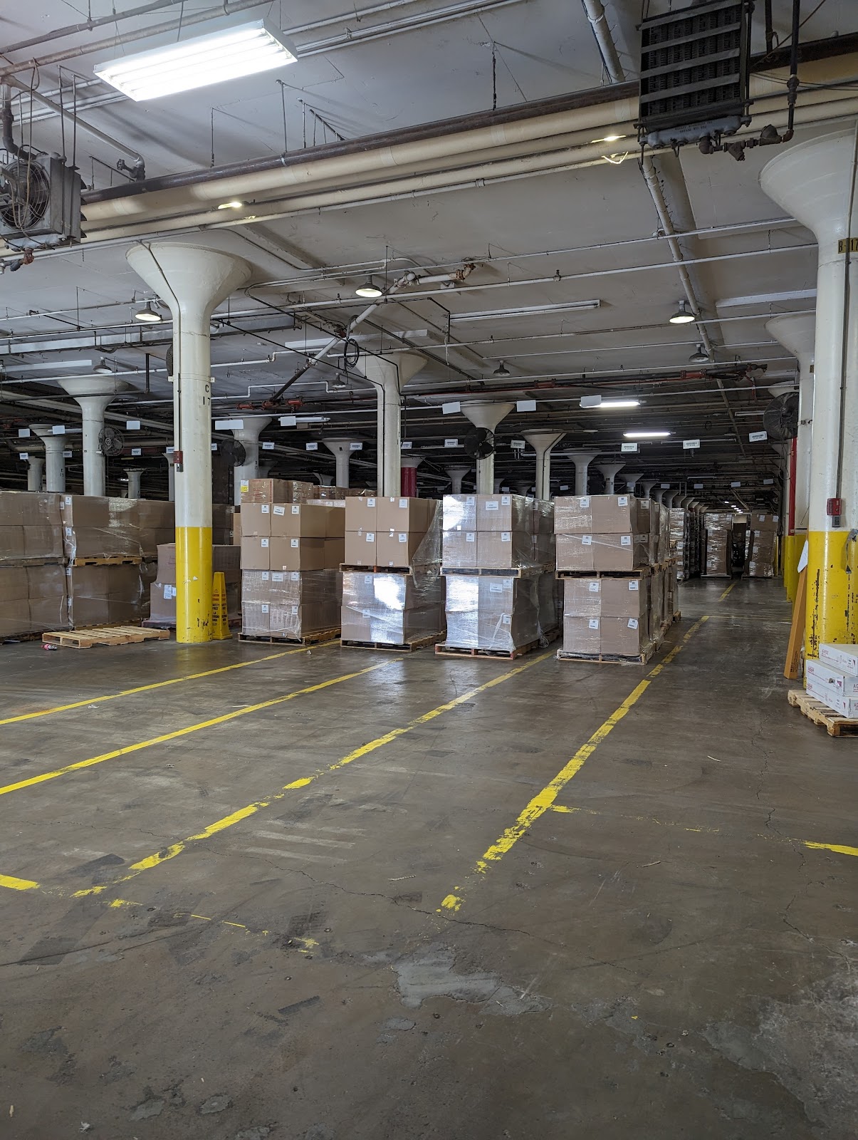 Warehouse interior with stacked pallets